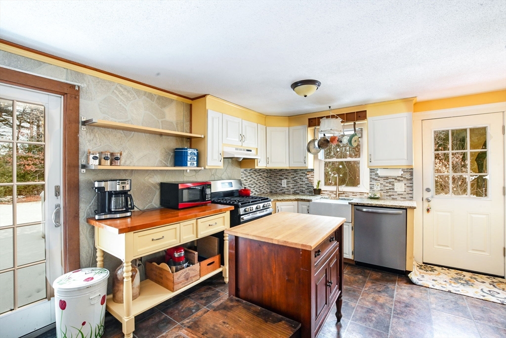 46 Service Road Sandwich, MA 02537 - Photo 6 of 35 a kitchen with a sink stove and cabinets