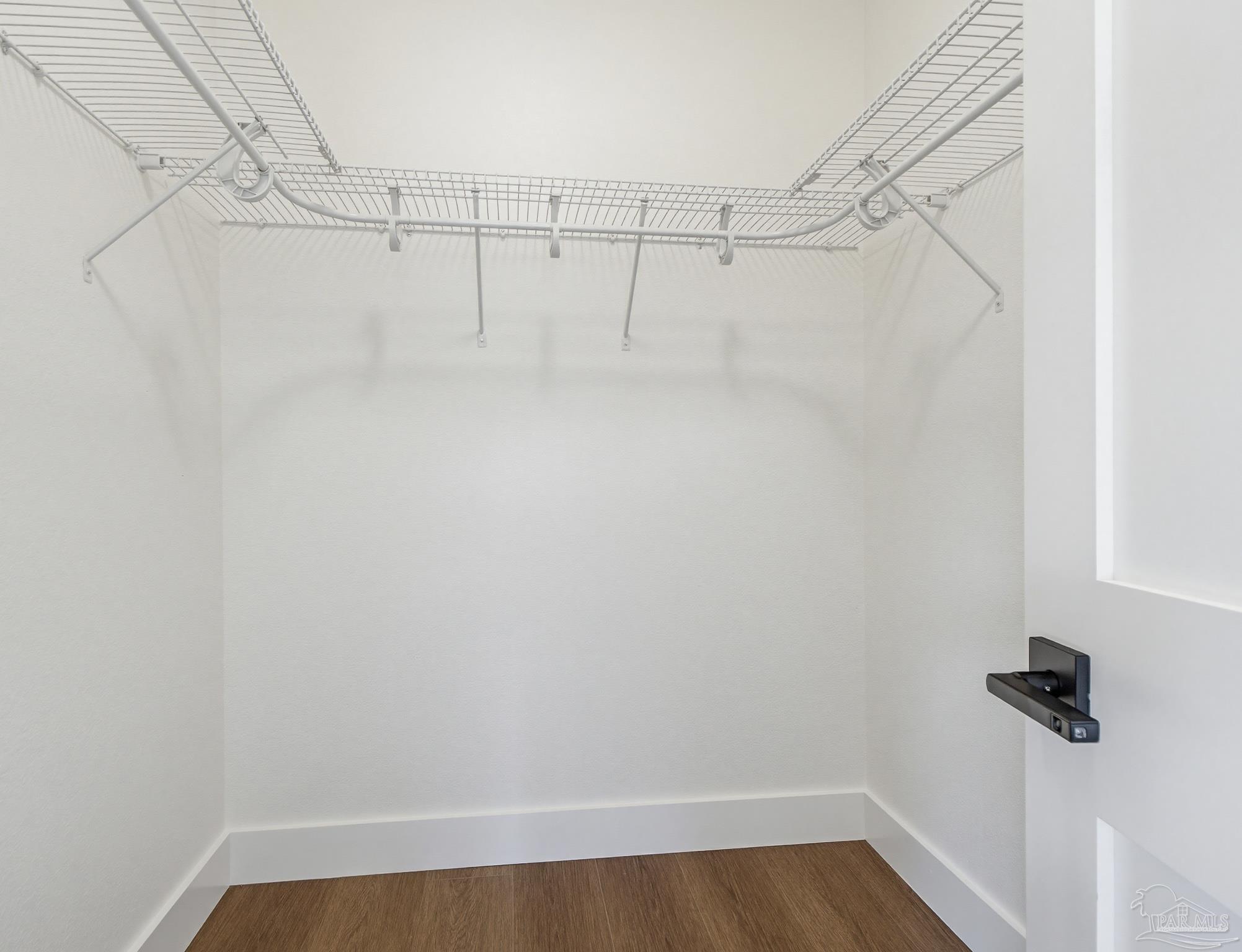 5724 Riviera Drive Milton, FL 32583 - Photo 32 of 52 a view of a room with racks on the wall