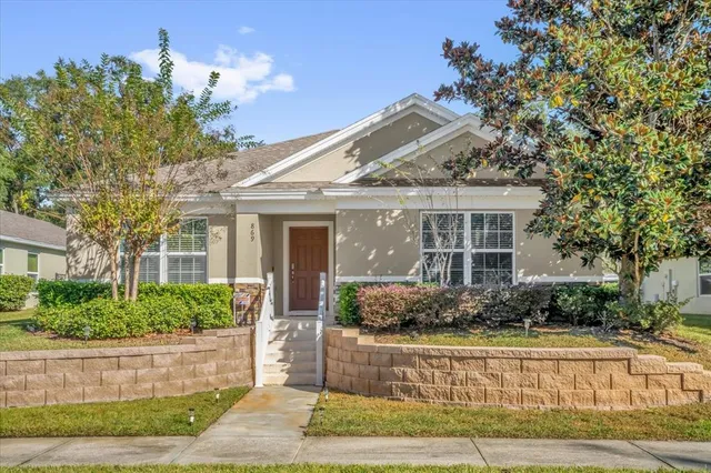 a front view of a house with garden