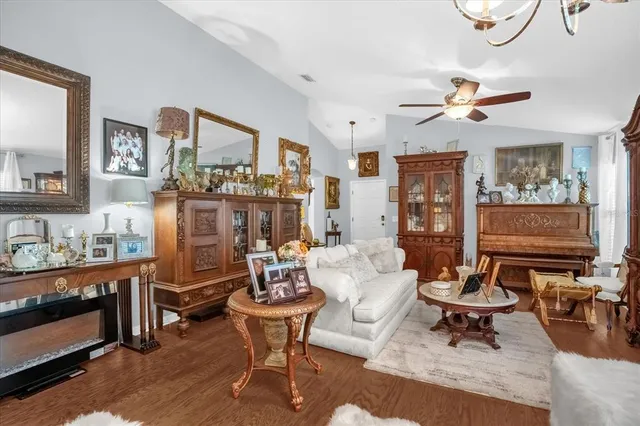 a living room with furniture a rug and a large window