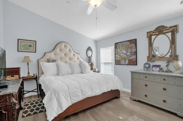 a bedroom with a bed and a dresser