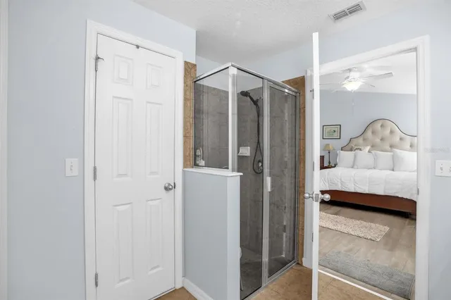 a bedroom with a bed and a walk in closet