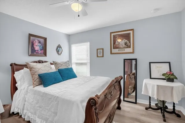 a bedroom with a bed and a table in it