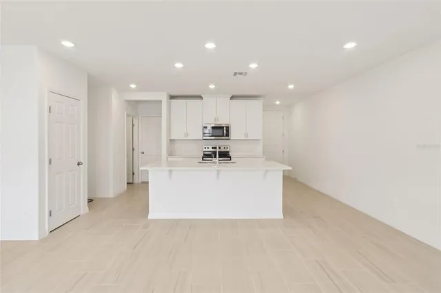 an empty room with sliding glass door