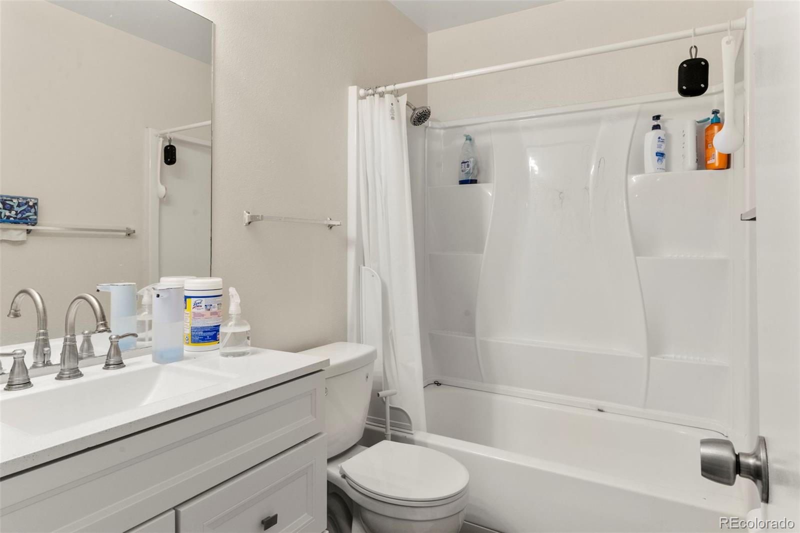 567-579 Winnie Way Colorado Springs, CO 80904 - Photo 18 of 32 a bathroom with a sink toilet and shower