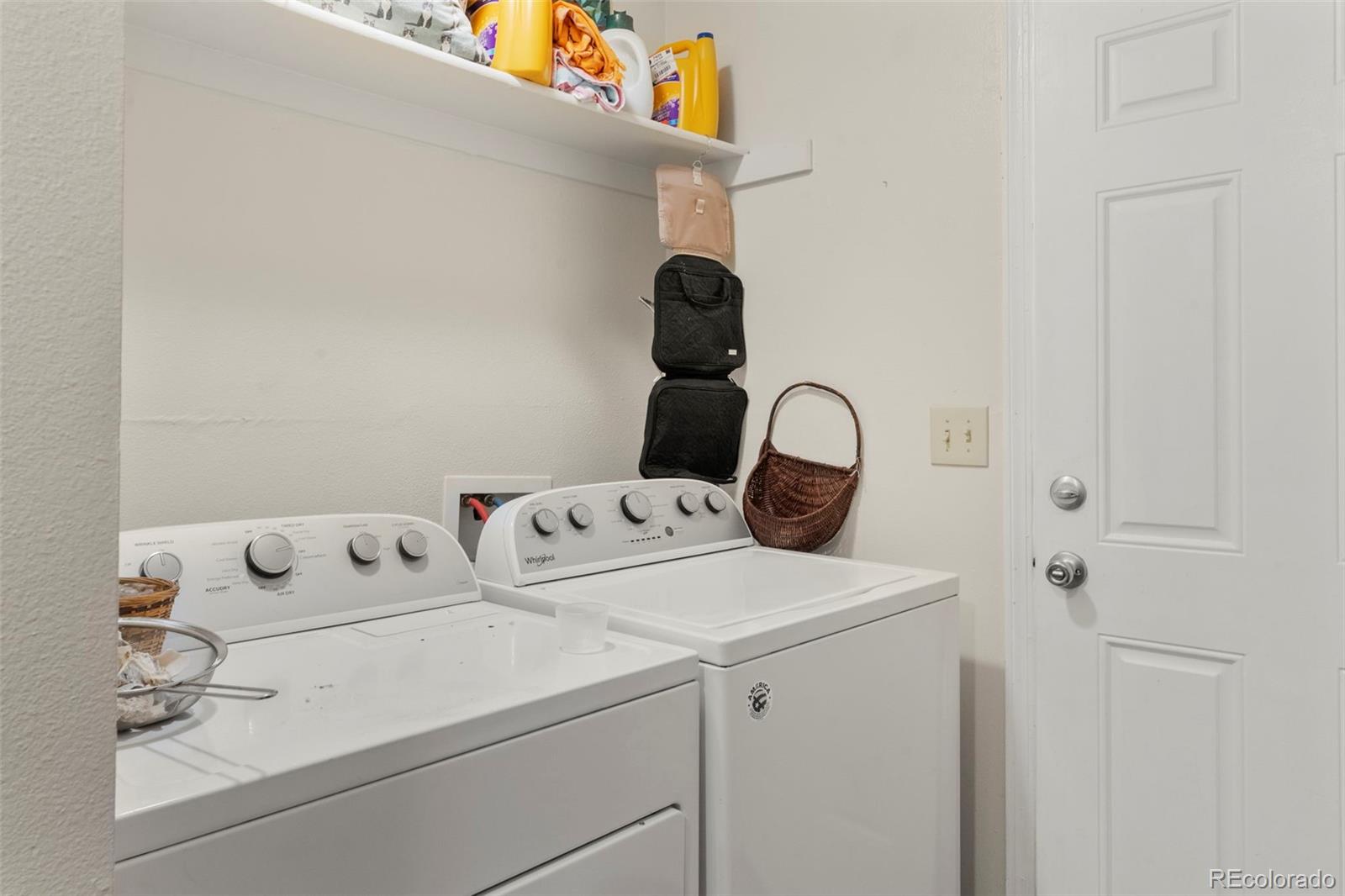 567-579 Winnie Way Colorado Springs, CO 80904 - Photo 20 of 32 a utility room with dryer and washer