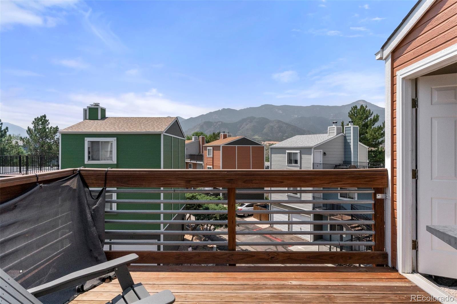 567-579 Winnie Way Colorado Springs, CO 80904 - Photo 24 of 32 a front view of a house with parking