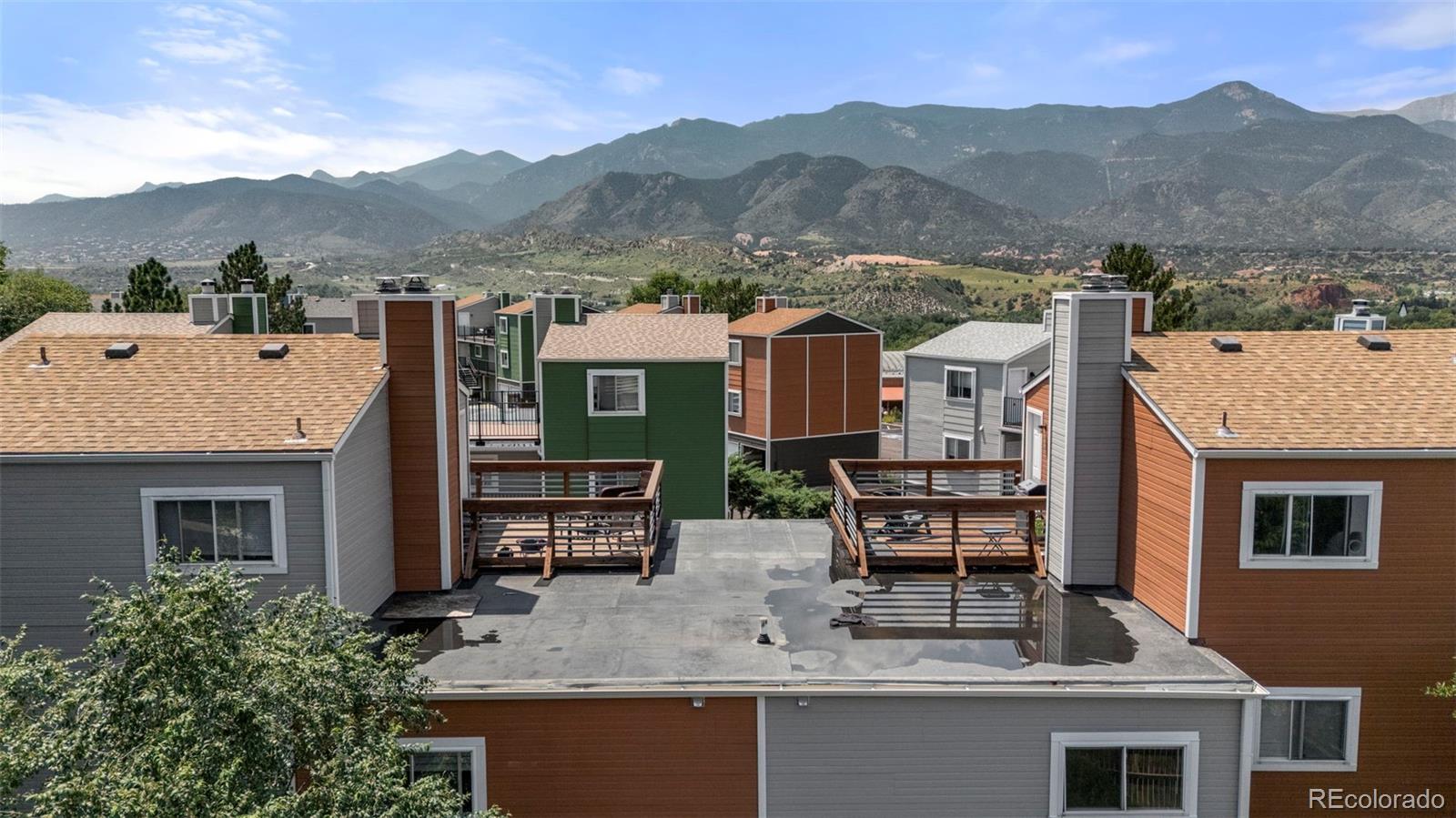 567-579 Winnie Way Colorado Springs, CO 80904 - Photo 26 of 32 a view of a house with mountain view