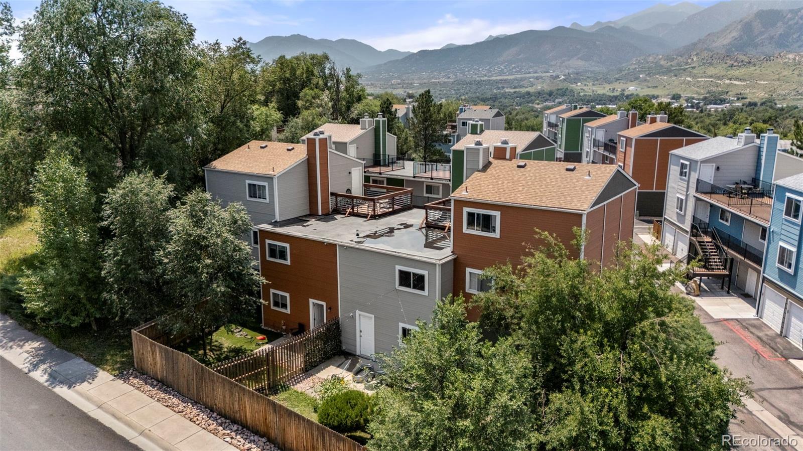 567-579 Winnie Way Colorado Springs, CO 80904 - Photo 28 of 32 an aerial view of a house with a yard