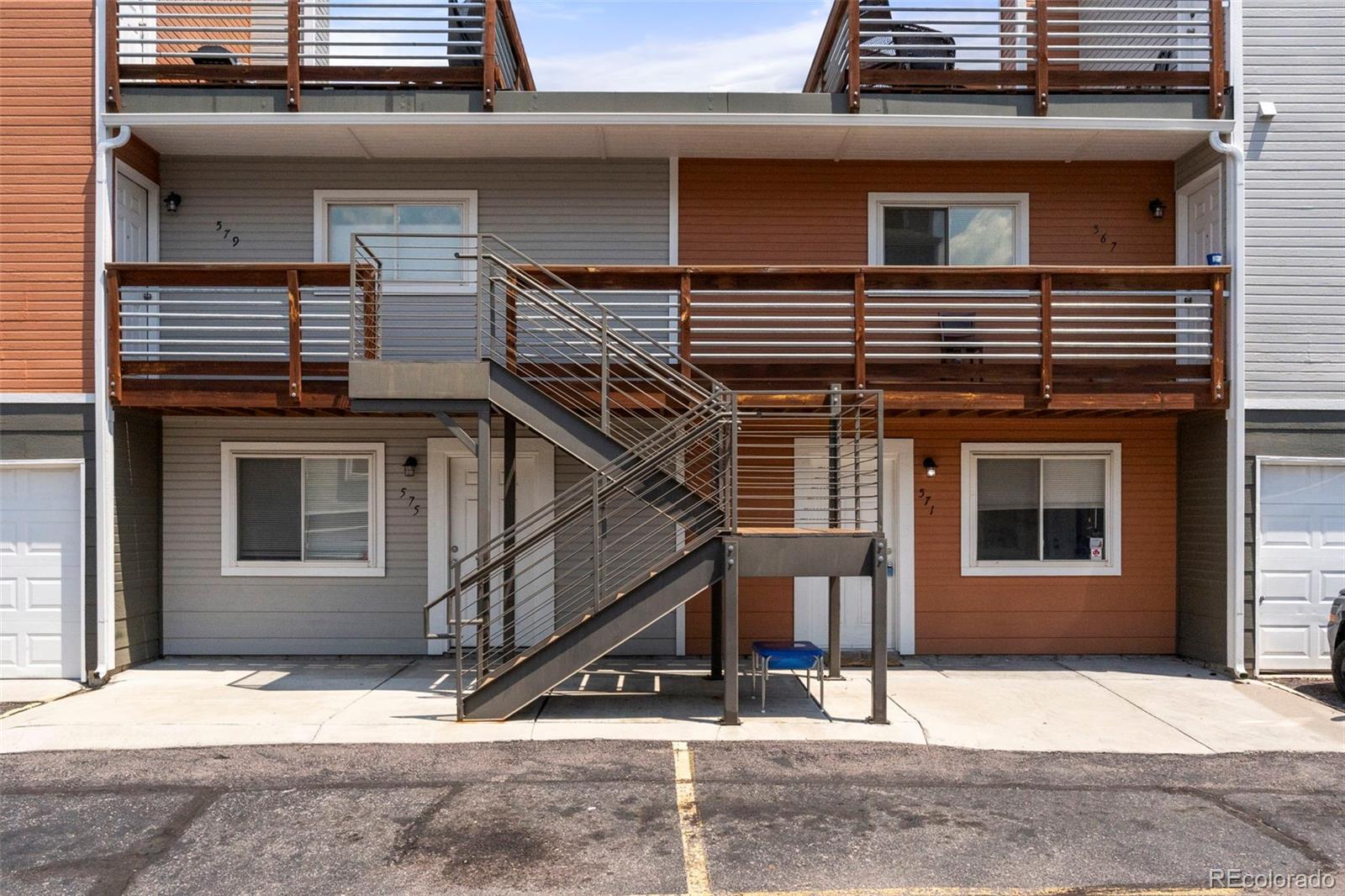567-579 Winnie Way Colorado Springs, CO 80904 - Photo 3 of 32 a front view of a house with garage