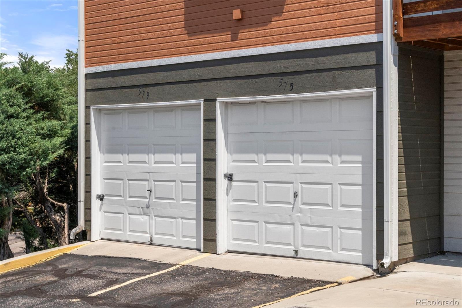 567-579 Winnie Way Colorado Springs, CO 80904 - Photo 4 of 32 a view of a wooden door of the house