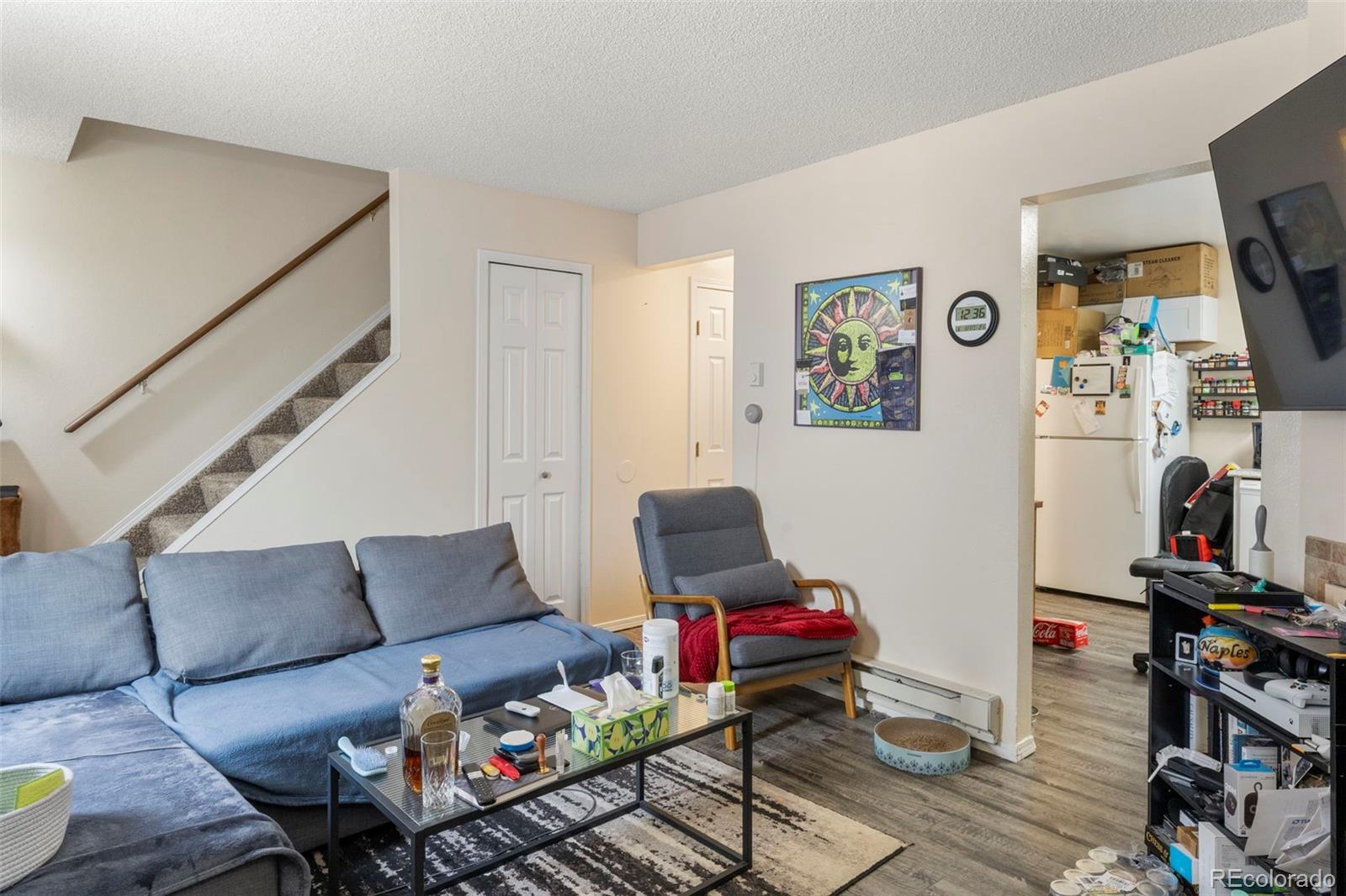 567-579 Winnie Way Colorado Springs, CO 80904 - Photo 7 of 32 a living room with furniture and a flat screen tv