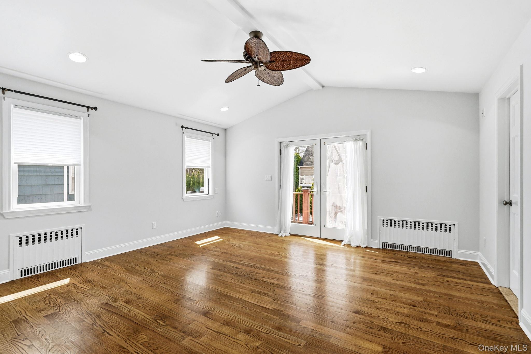 317 Hornidge Road Mamaroneck, NY 10543 - Photo 12 of 21 a view of an empty room with wooden floor and a window