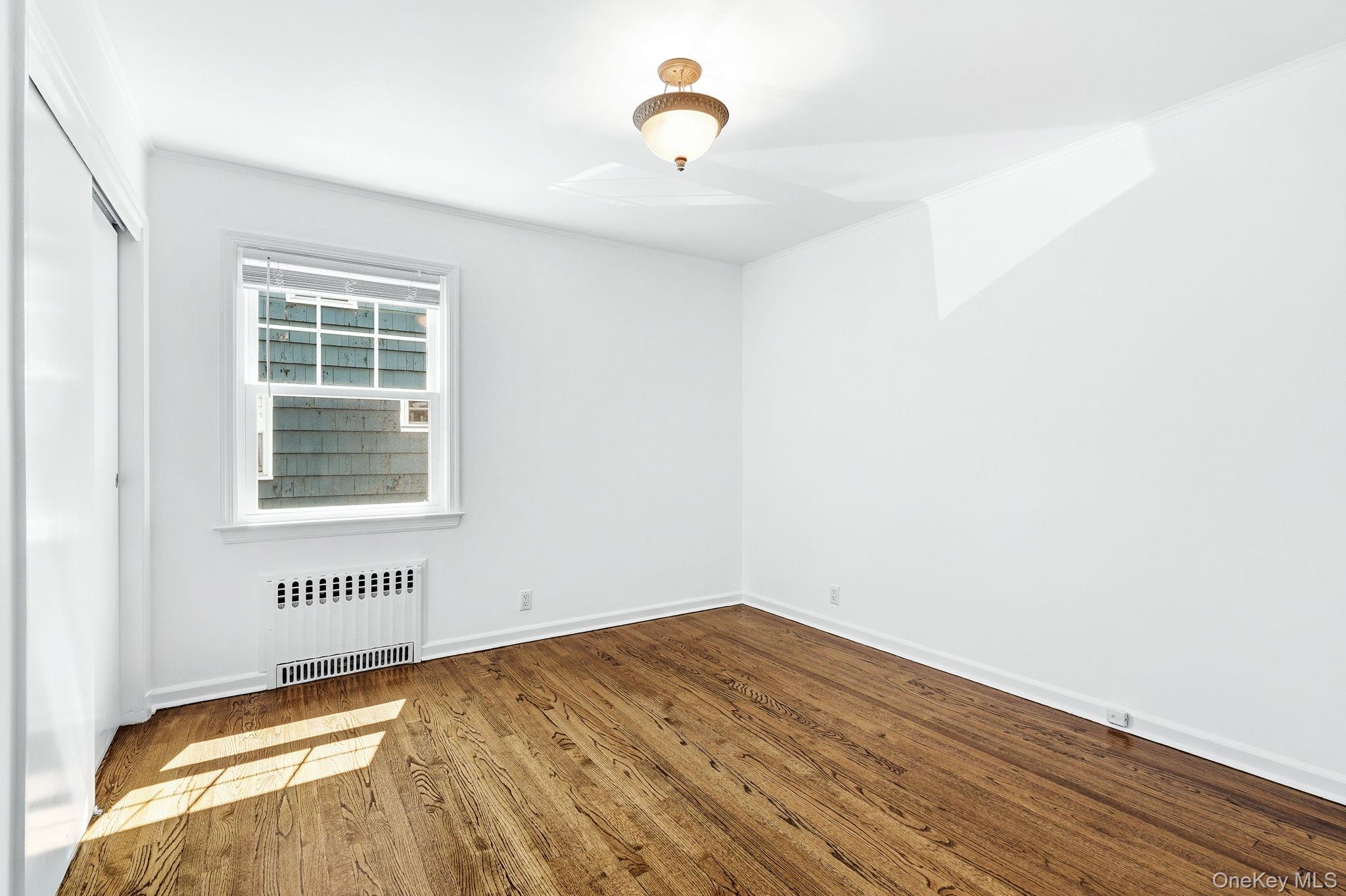 317 Hornidge Road Mamaroneck, NY 10543 - Photo 17 of 21 a view of a room with wooden floor and a window