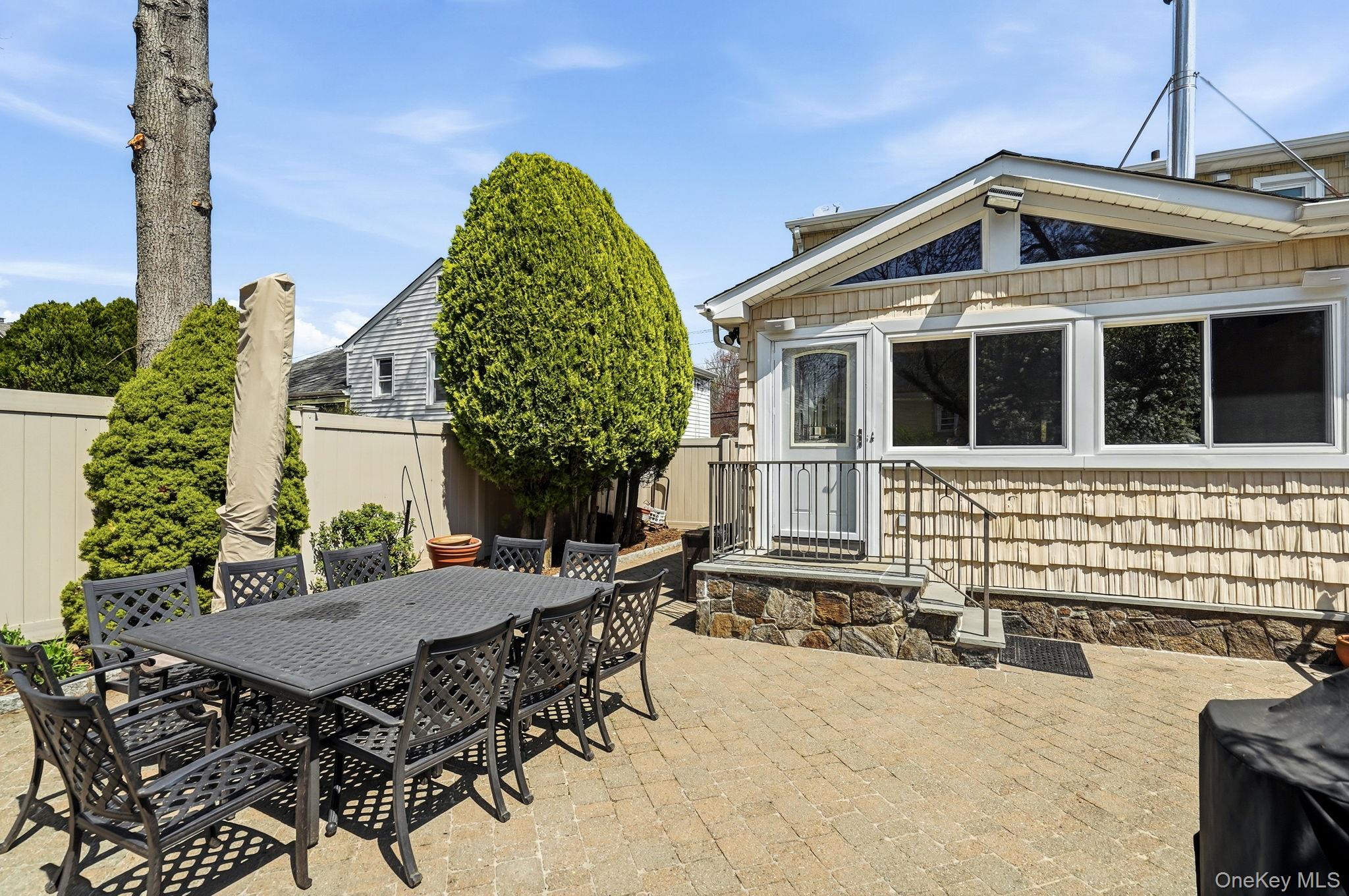 317 Hornidge Road Mamaroneck, NY 10543 - Photo 19 of 21 a front view of a house with a yard