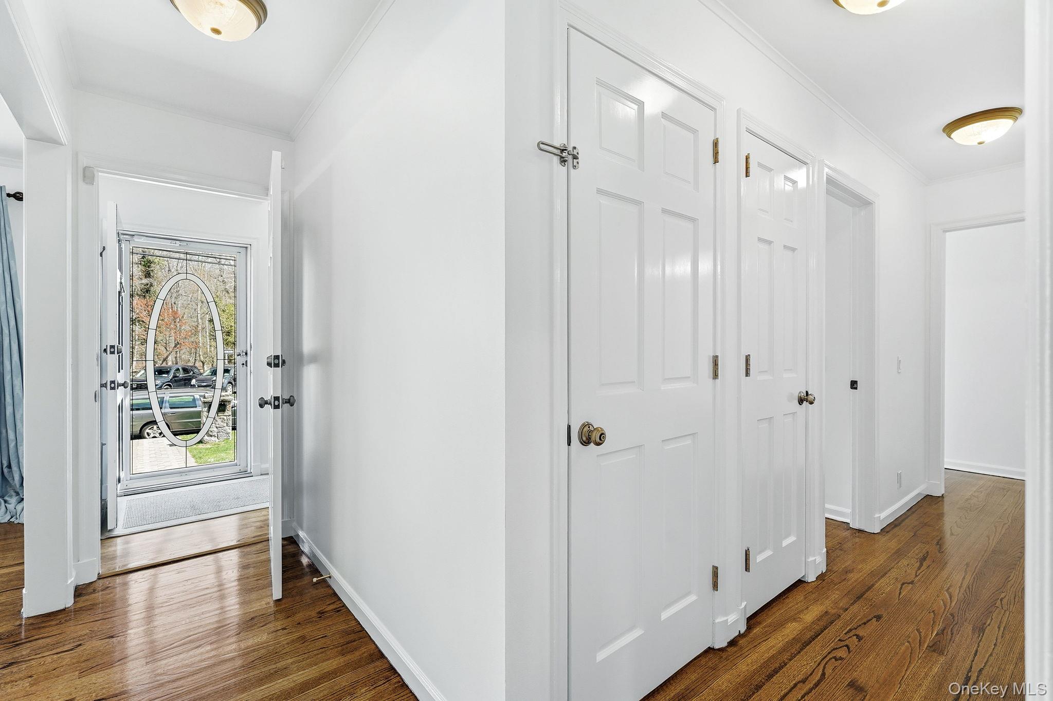 317 Hornidge Road Mamaroneck, NY 10543 - Photo 3 of 21 a view of a hallway with wooden floor and closet