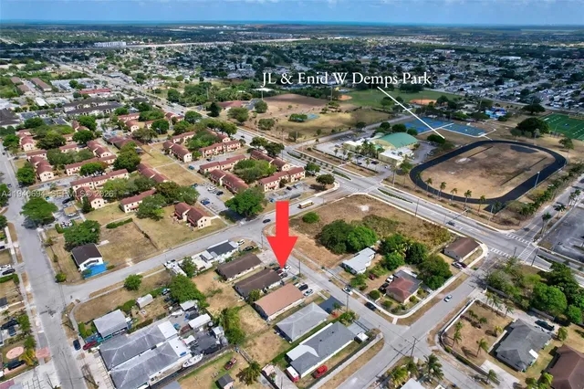 an aerial view of residential houses with outdoor space