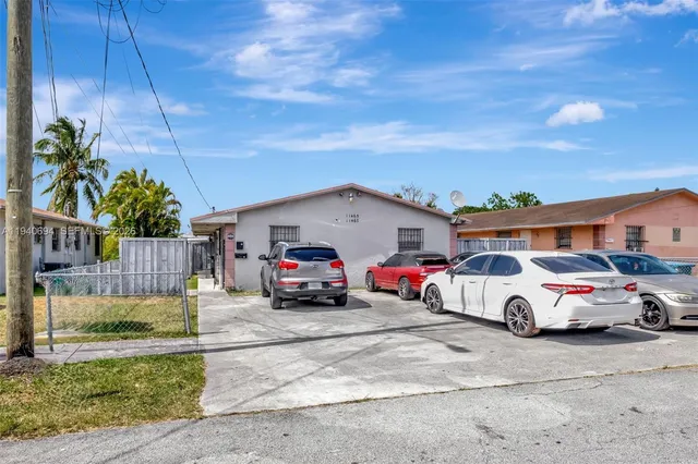 a view of parking space with cars parked