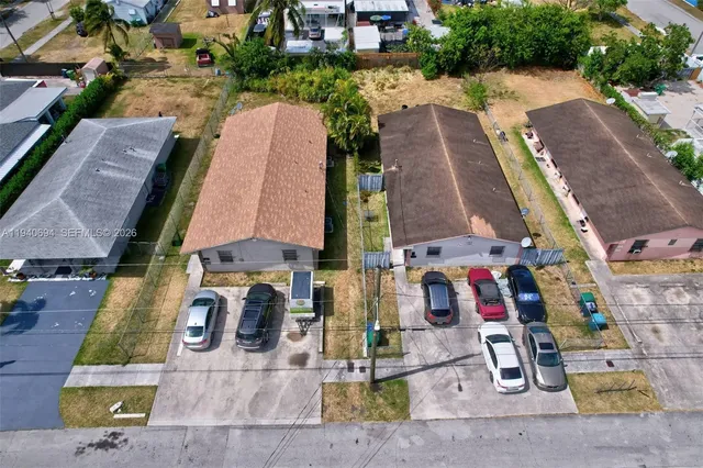 an aerial view of houses with outdoor space
