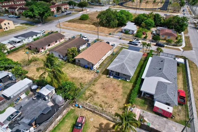 an aerial view of a houses with outdoor space