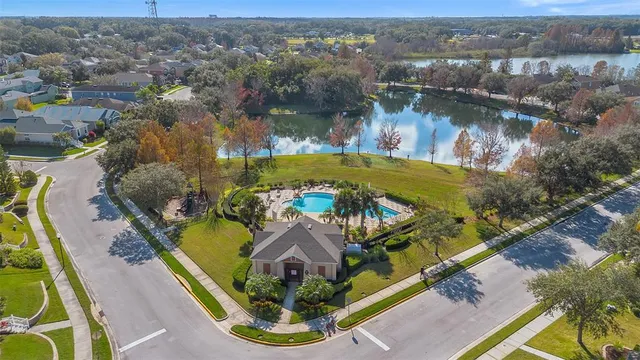 an aerial view of a house with a swimming pool