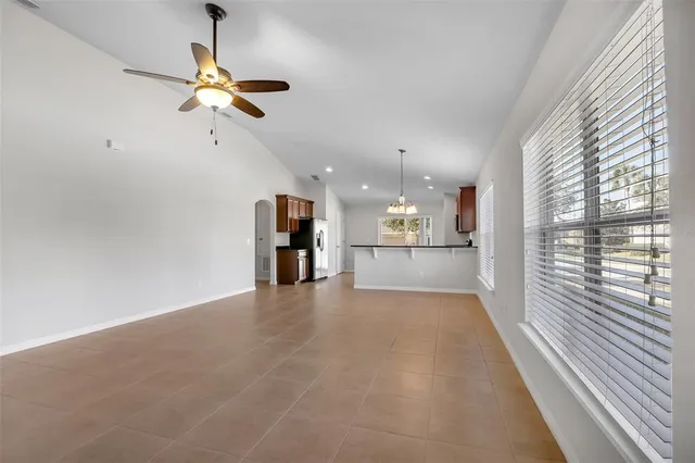 a view of a kitchen with a dishwasher and white cabinets