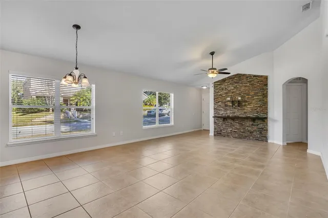 a view of a livingroom with a window and a chandelier