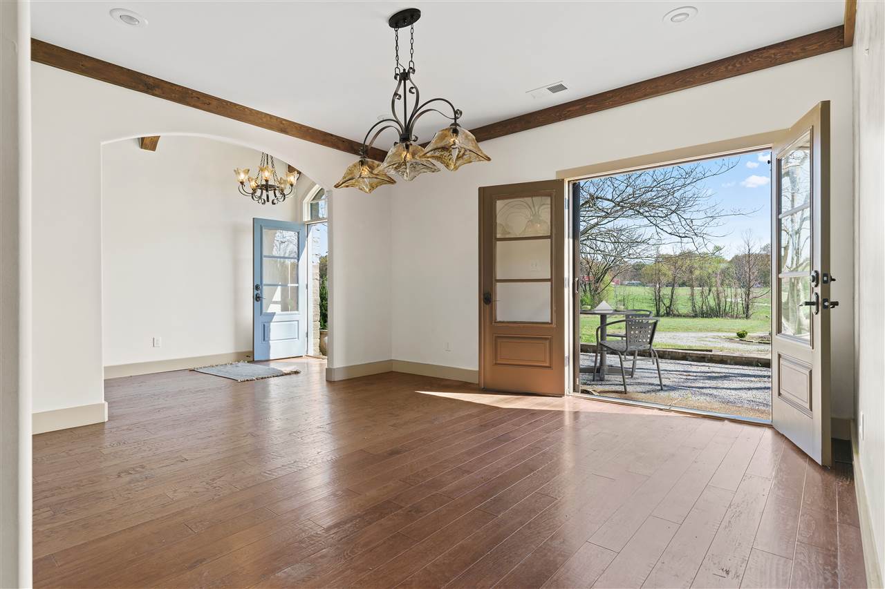 3887 Lucy Road Millington, TN 38053 - Photo 3 of 25 Formal DINING ROOM with Hardwood, Custom Molding, and Smooth Ceiling. Enjoy dining "al fresco" with the doors open and fresh air! Photo virtually staged.