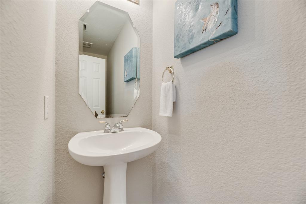 4404 Ridge Point Lane Plano, TX 75024 - Photo 13 of 18 a bathroom with a sink and a mirror
