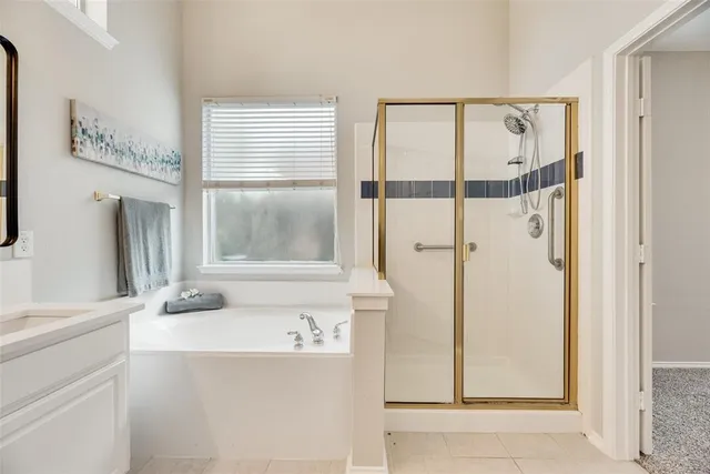 a bathroom with a bathtub and a sink
