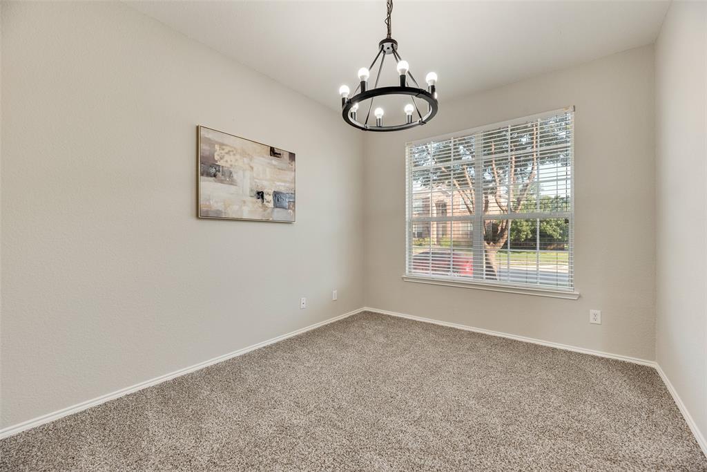 4404 Ridge Point Lane Plano, TX 75024 - Photo 3 of 18 a view of an empty room with windows and chandelier