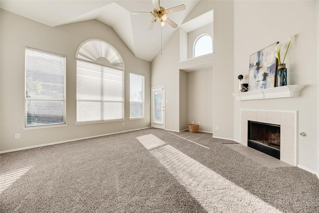 4404 Ridge Point Lane Plano, TX 75024 - Photo 4 of 18 a view of an empty room with a fireplace and a window