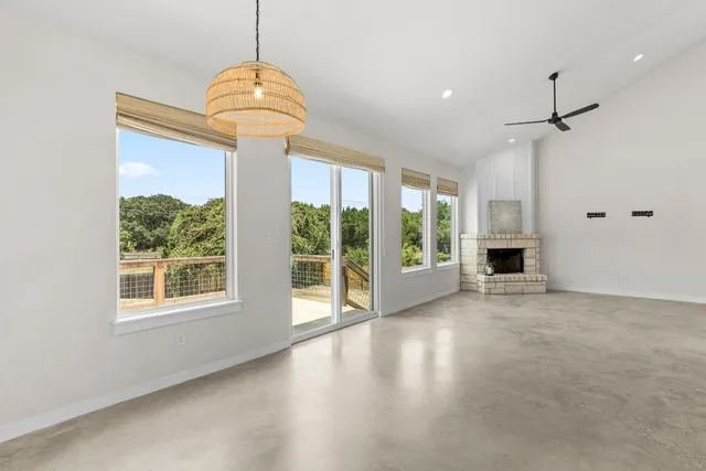 a view of livingroom with furniture wooden floor and windows