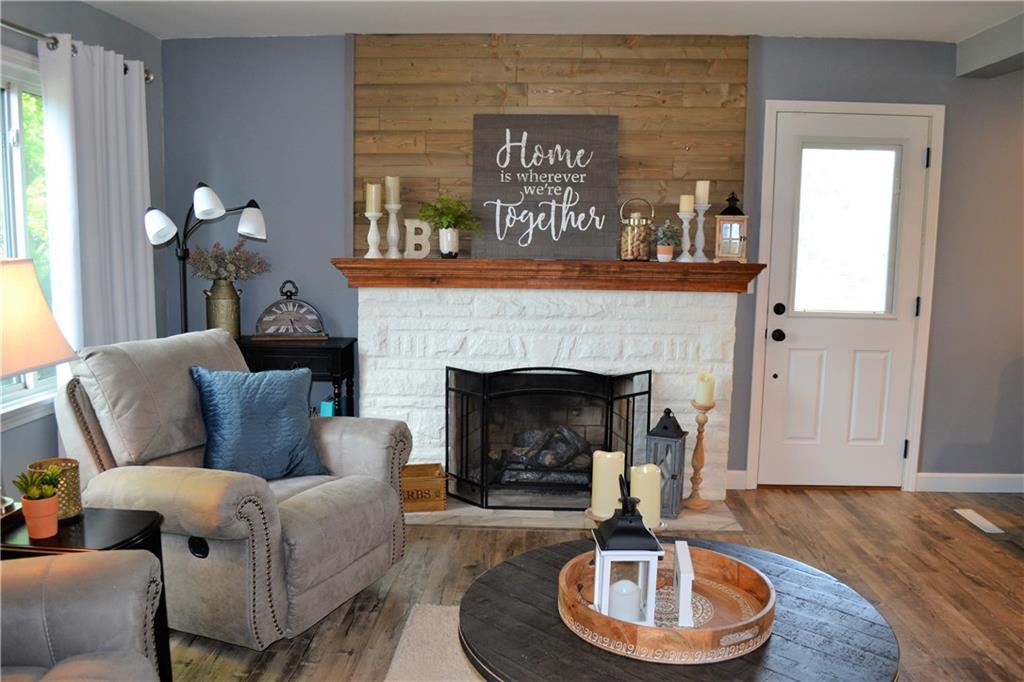 1515 Butler Road Worthington, PA 16262 - Photo 13 of 25 The updated gas fireplace features a custom mantle and plank accent wall.