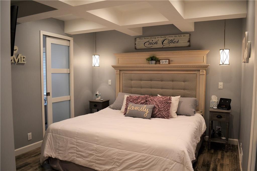 1515 Butler Road Worthington, PA 16262 - Photo 14 of 25 The master suite features LVP flooring, coffered ceiling, recessed lighting, pocket doors, a large master bath, and a 15x7 walk in closet with laundry hookups.