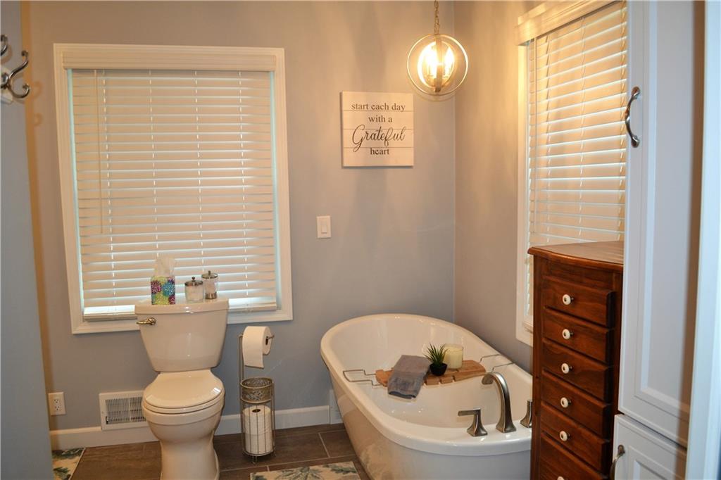 1515 Butler Road Worthington, PA 16262 - Photo 15 of 25 The master bath was completed in 2018 and includes a soaking tub, ceramic tile flooring, and decorative light fixtures.