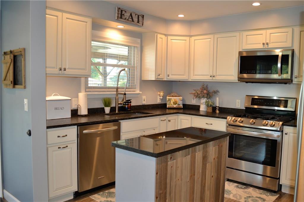 1515 Butler Road Worthington, PA 16262 - Photo 9 of 25 The updated kitchen features soft close cabinets, granite countertops, under cabinet lighting, and stainless steel appliances.