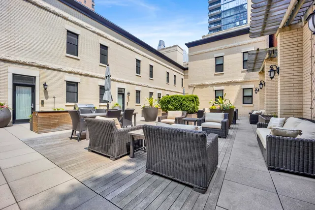 a view of a patio with couches table and chairs