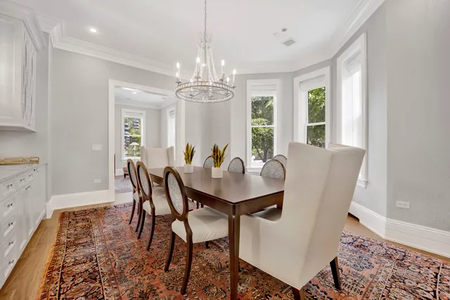 a kitchen with a sink a stove and cabinets