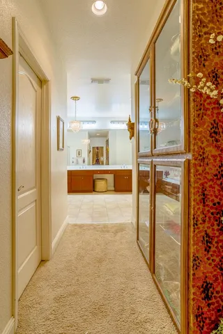 a bathroom with a tub a sink and a mirror