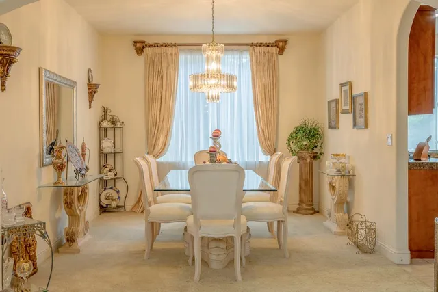 a dining room with furniture window and outside view