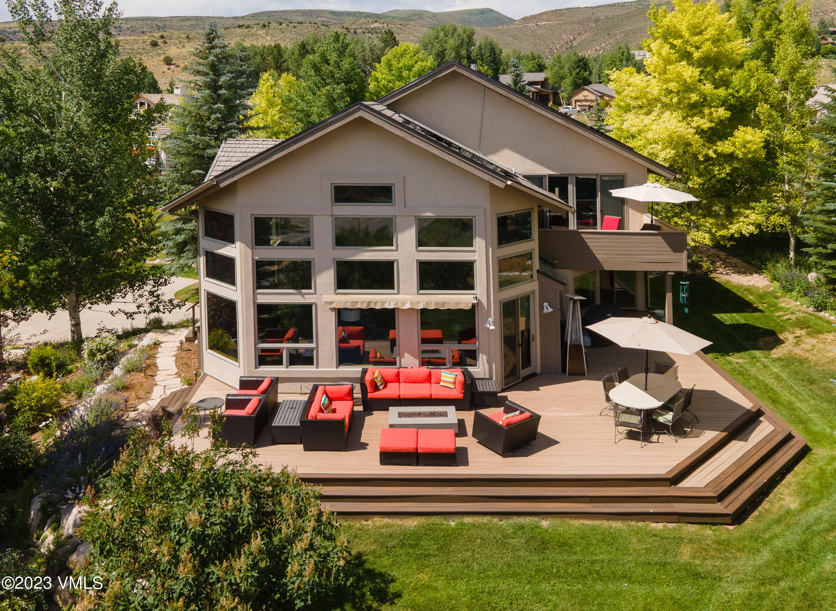 a car parked in front of a house with a small yard