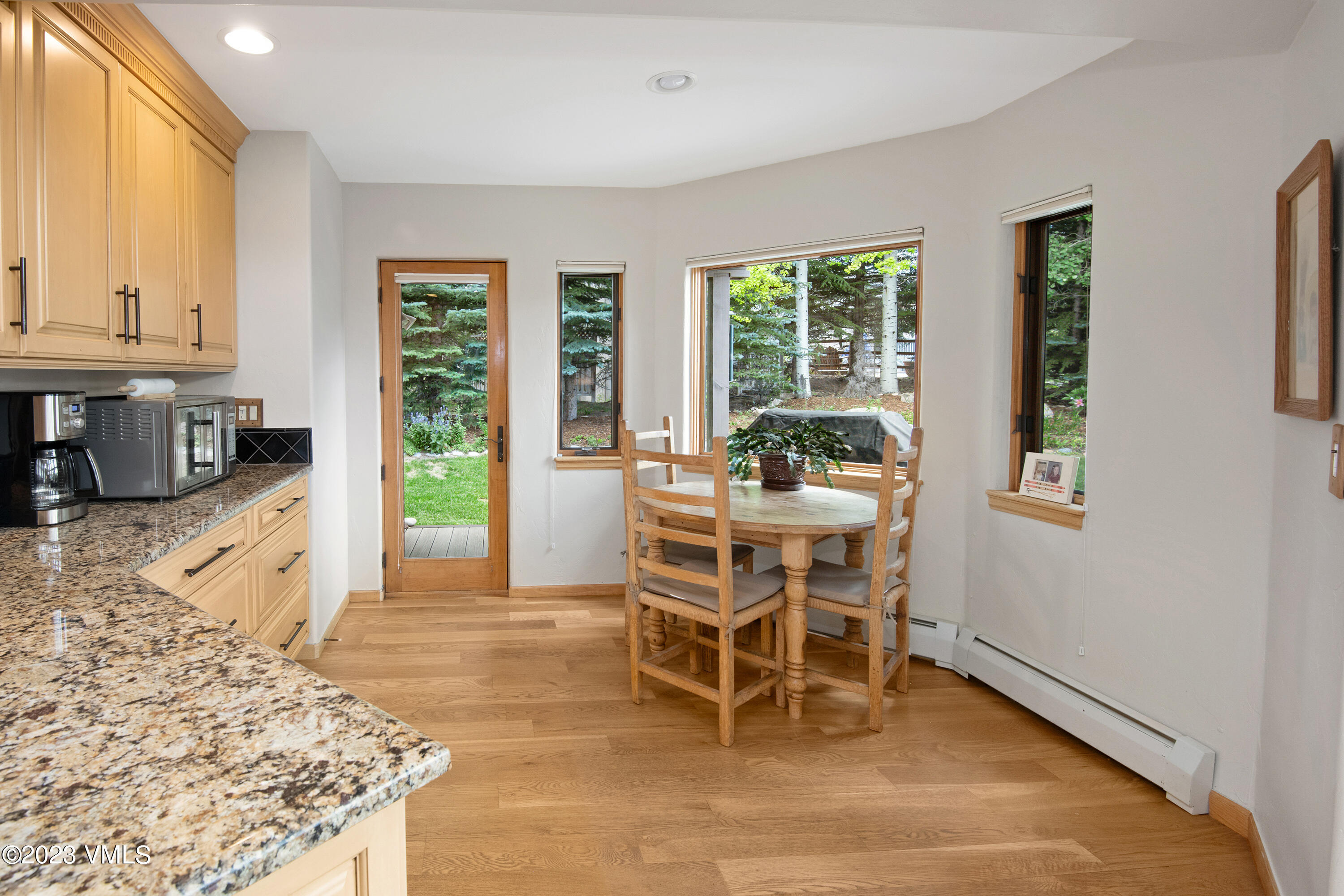 1471 Singletree Road Edwards, CO 81632 - Photo 18 of 47 a dining room with furniture and large windows