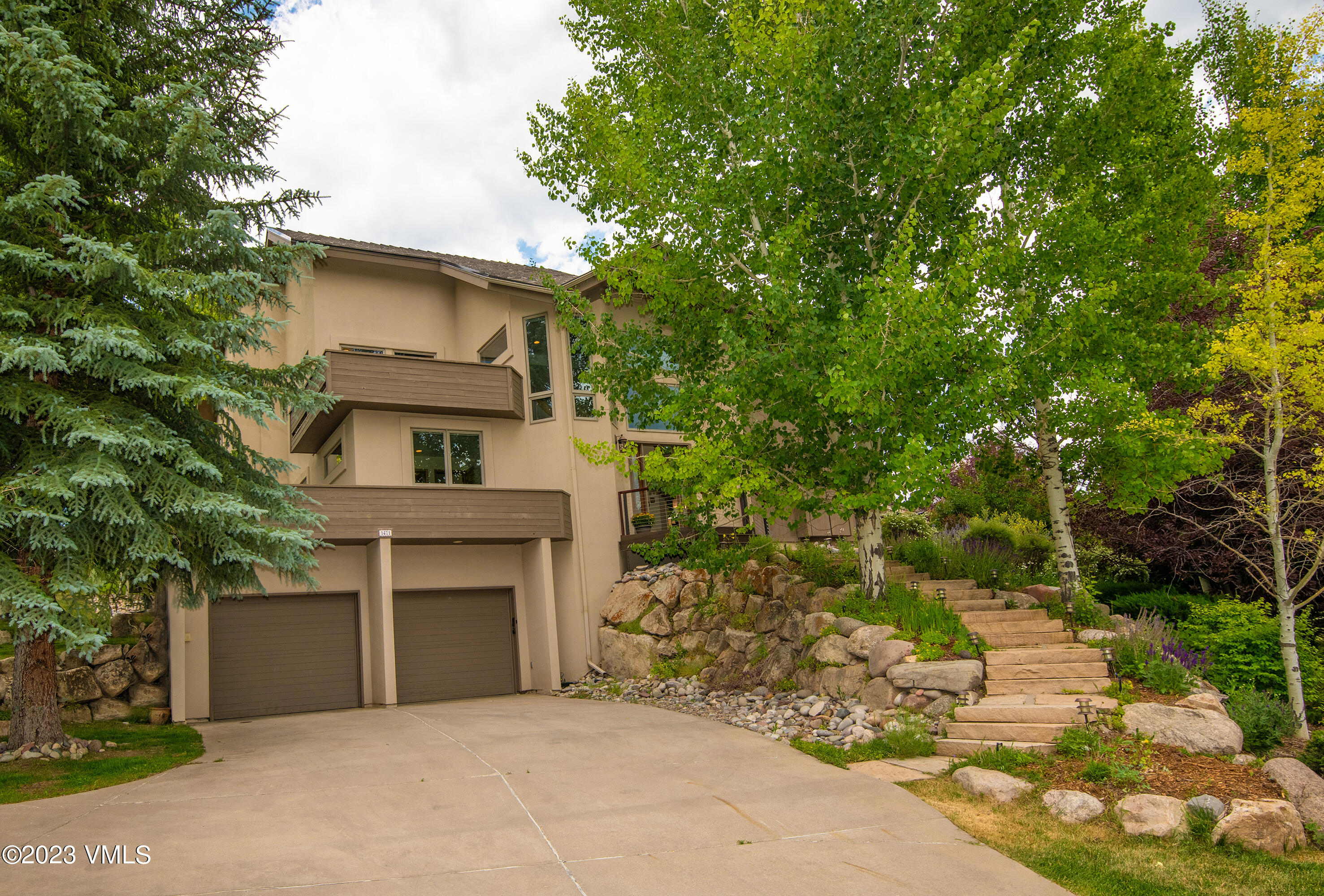 1471 Singletree Road Edwards, CO 81632 - Photo 2 of 47 a front view of a house with a yard