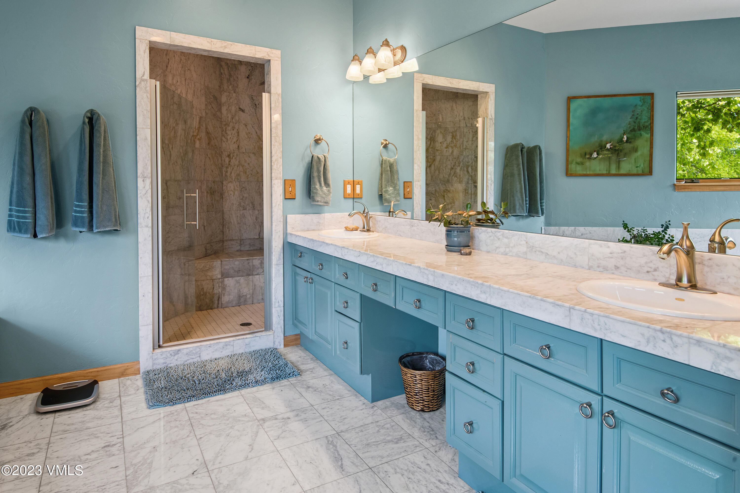 1471 Singletree Road Edwards, CO 81632 - Photo 22 of 47 a bathroom with a double vanity sink mirror and shower