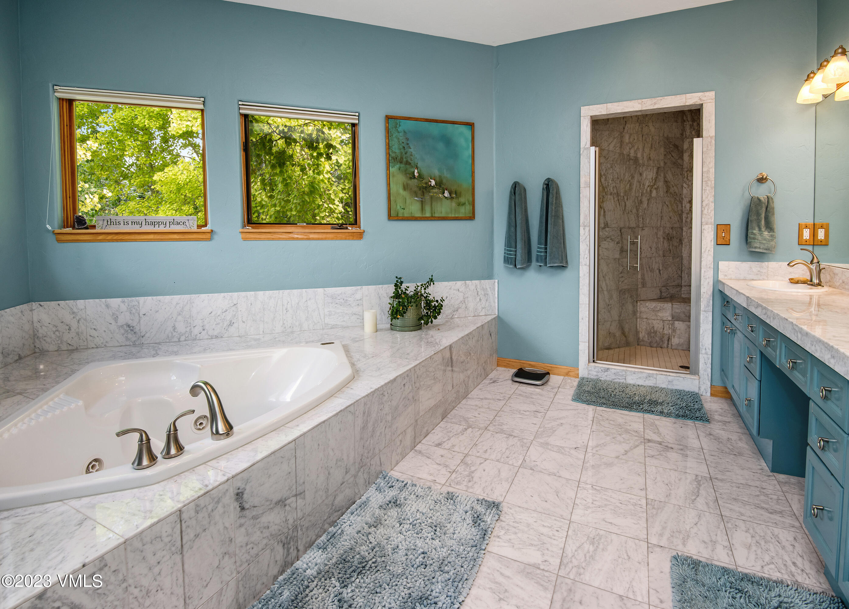 1471 Singletree Road Edwards, CO 81632 - Photo 23 of 47 a spacious bathroom with a tub sink and mirror