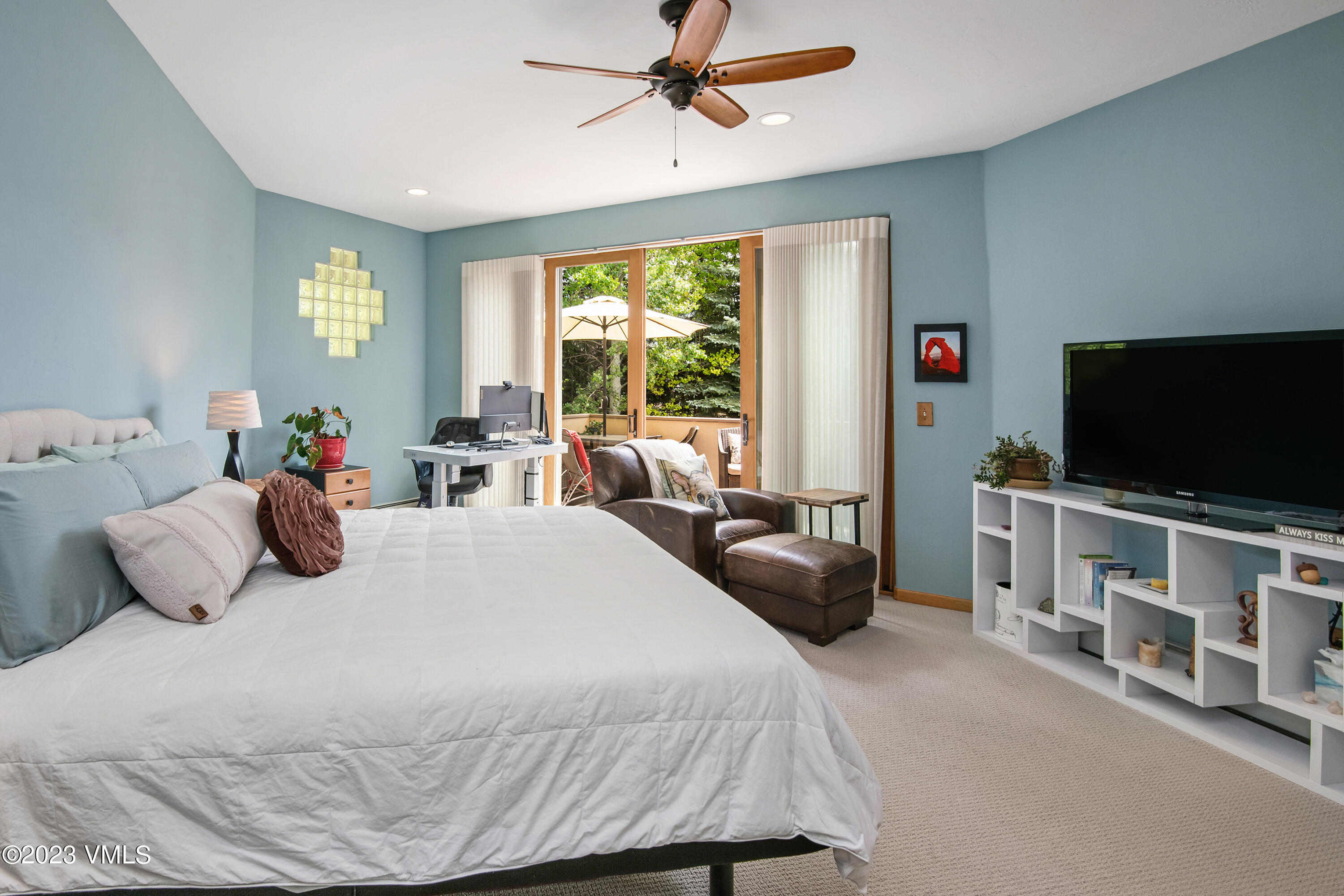 1471 Singletree Road Edwards, CO 81632 - Photo 25 of 47 a bedroom with a bed and a flat tv screen on dresser
