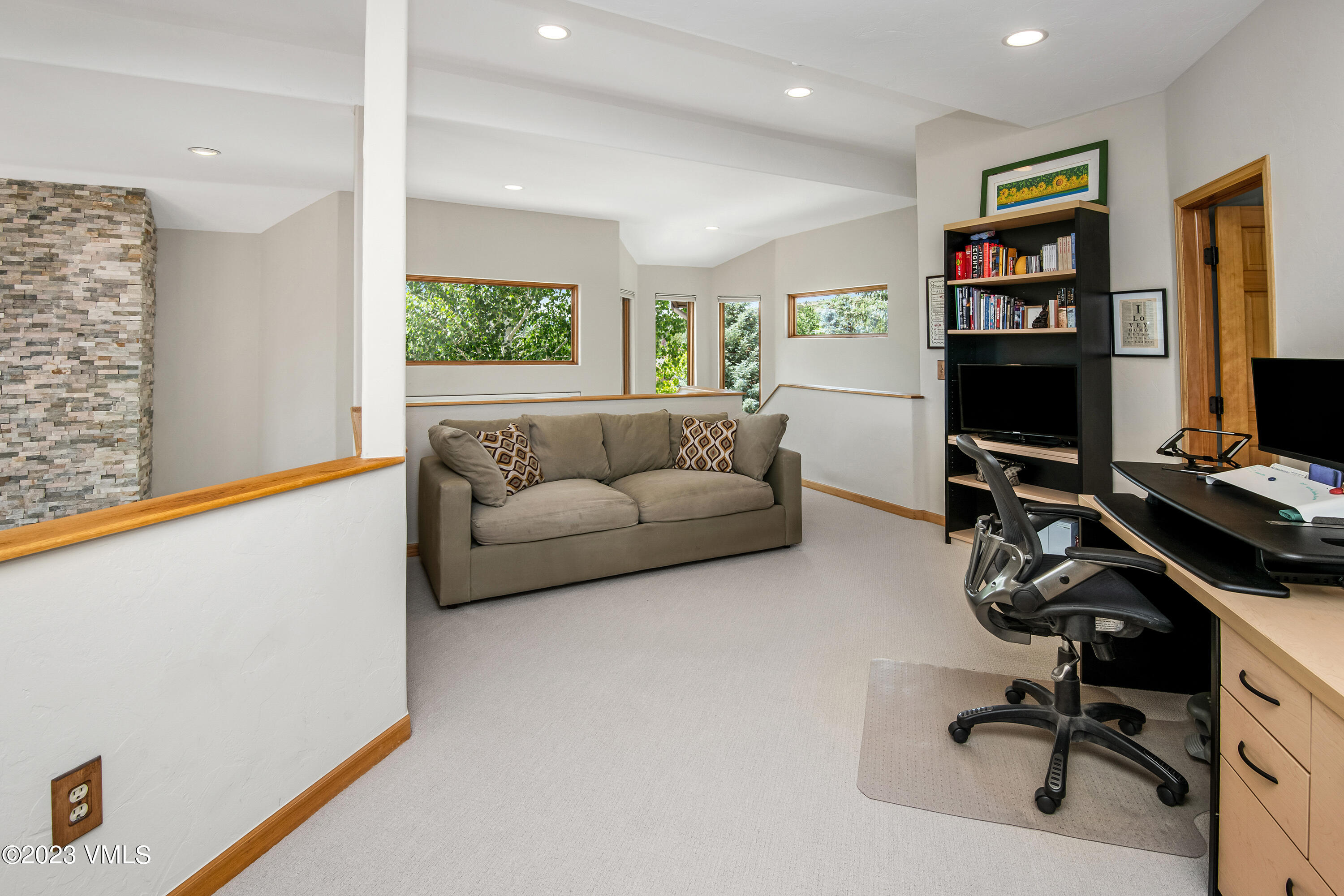 1471 Singletree Road Edwards, CO 81632 - Photo 27 of 47 a living room with furniture and a flat screen tv