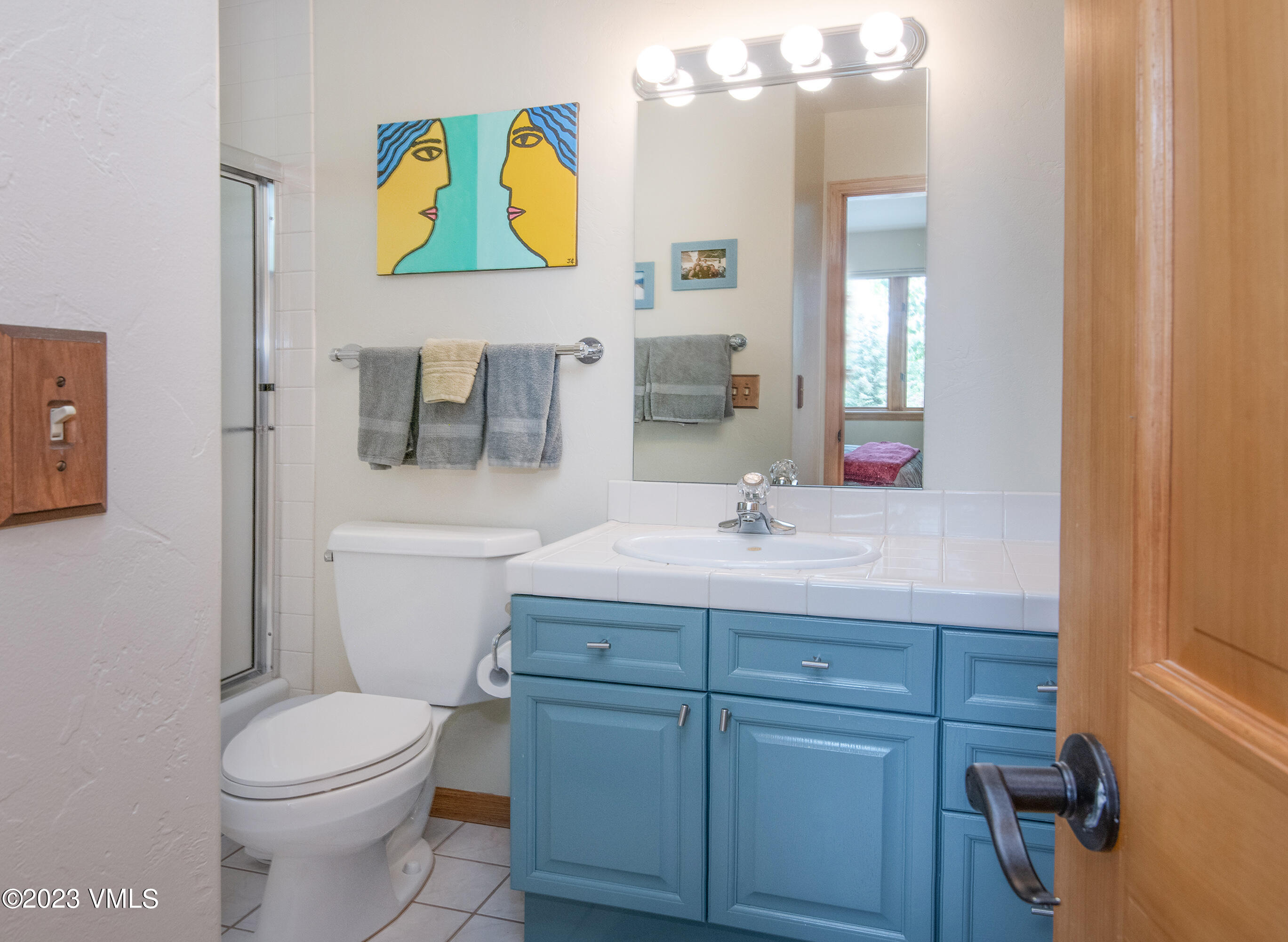 1471 Singletree Road Edwards, CO 81632 - Photo 29 of 47 a bathroom with a toilet sink and mirror
