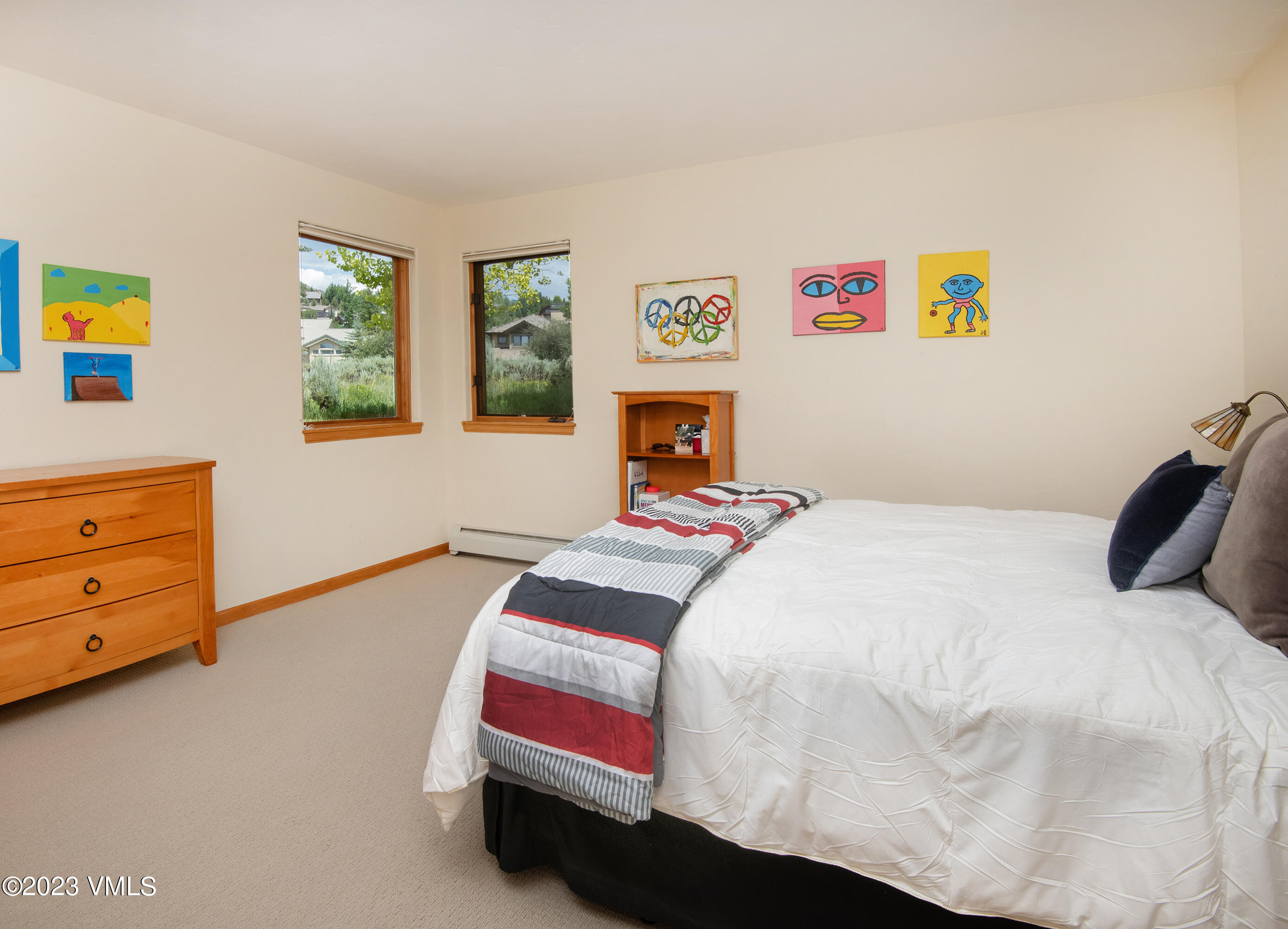 1471 Singletree Road Edwards, CO 81632 - Photo 30 of 47 a bedroom with a bed and a dresser next to a window